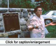 Standing in front of the Acadian Cross Historic Shrine in Madawaska, Bernette Albert explains the landing of the Valley's first Acadian families.