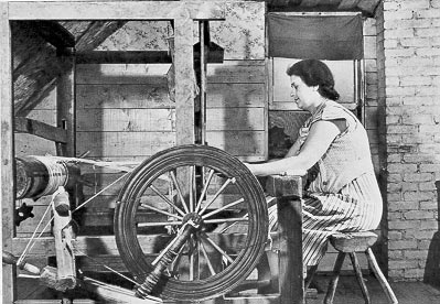 Marie Albert Dumond weaving on an old loom in one of the upstairs bedrooms of her home in Lille, Maine, October 1940. Hand-woven blankets made by Mrs. Dumond and her mother-in-law are now on display at the Acadian Village in Van Buren.