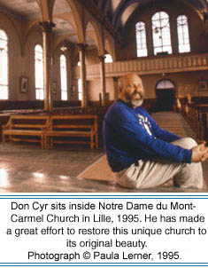 Don Cyr sits inside Notre Dame du Mont-Carmel Church in Lille, 1995. He has made a great effort to restoring this unique church to its original beauty.  Photographer, Paula Lerner,   2003.
